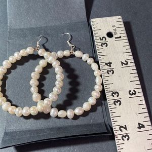 Sterling silver fish hook clasp with fresh water pearl hoop earrings.